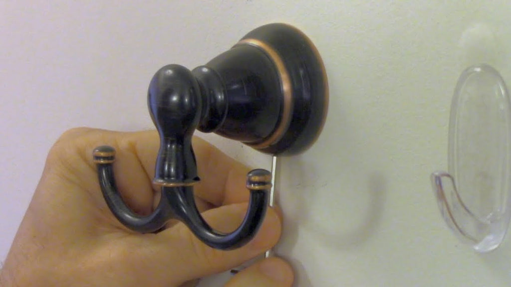 This video shows you have to install a bathroom towel or bathrobe hook.